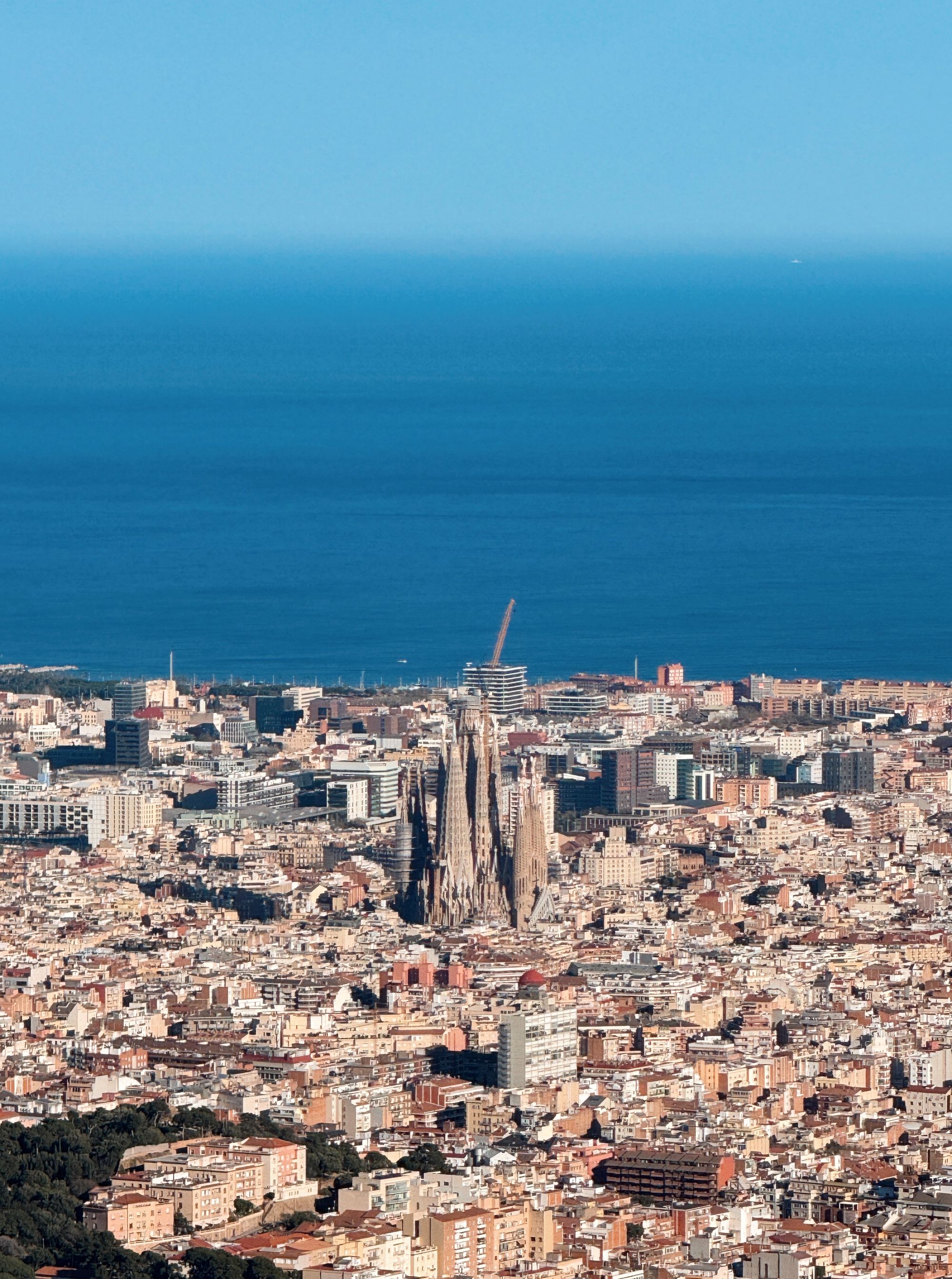 Aerial view of Barcelona with the Sagrada Família and the sea