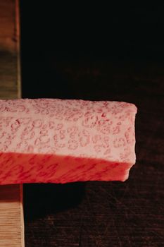 Marbled Wagyu beef with intricate fat patterns, ready for gourmet culinary preparation.
