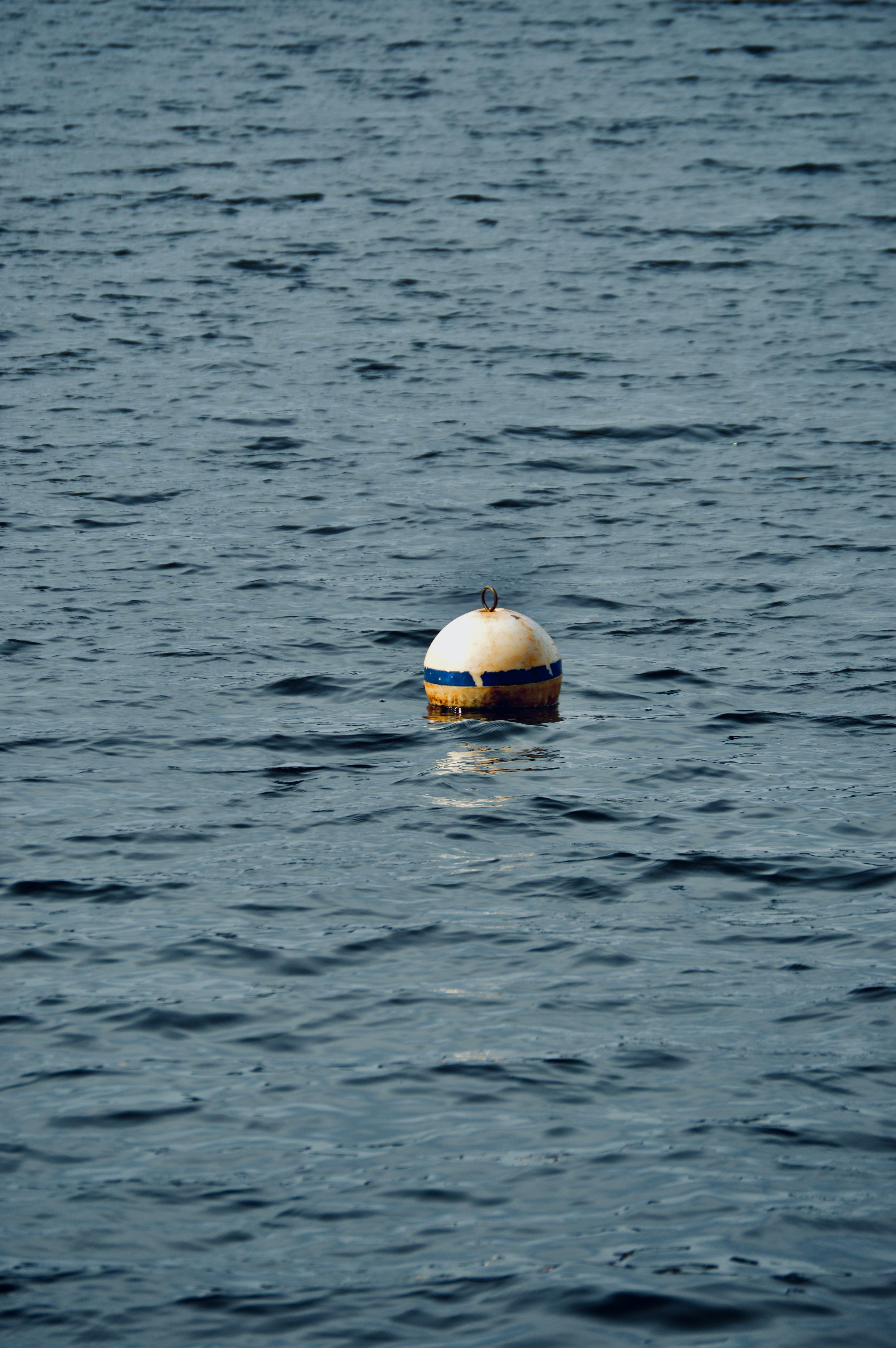 A solitary buoy floats on the calm waters of Pocono Pines, Pennsylvania.