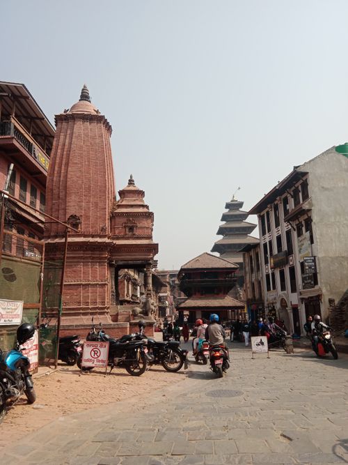 Free Patan Durbar Square showcasing historic temples and vibrant city life in Kathmandu Valley, Nepal. Stock Photo