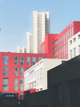 Striking red and white buildings with a modern architectural design in Tianjin, China.