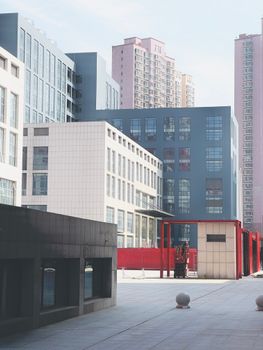 Contemporary urban architecture featuring modern buildings in a cityscape on a sunny day.