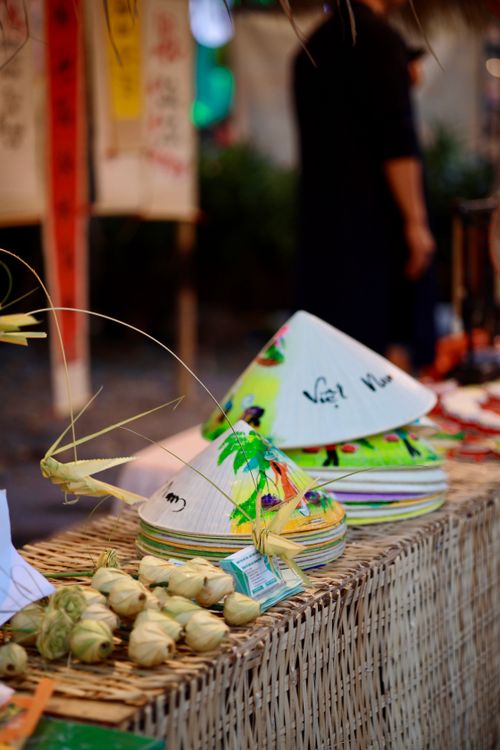 Free Vibrant stack of Vietnamese conical hats on display at an outdoor market, evoking cultural charm. Stock Photo