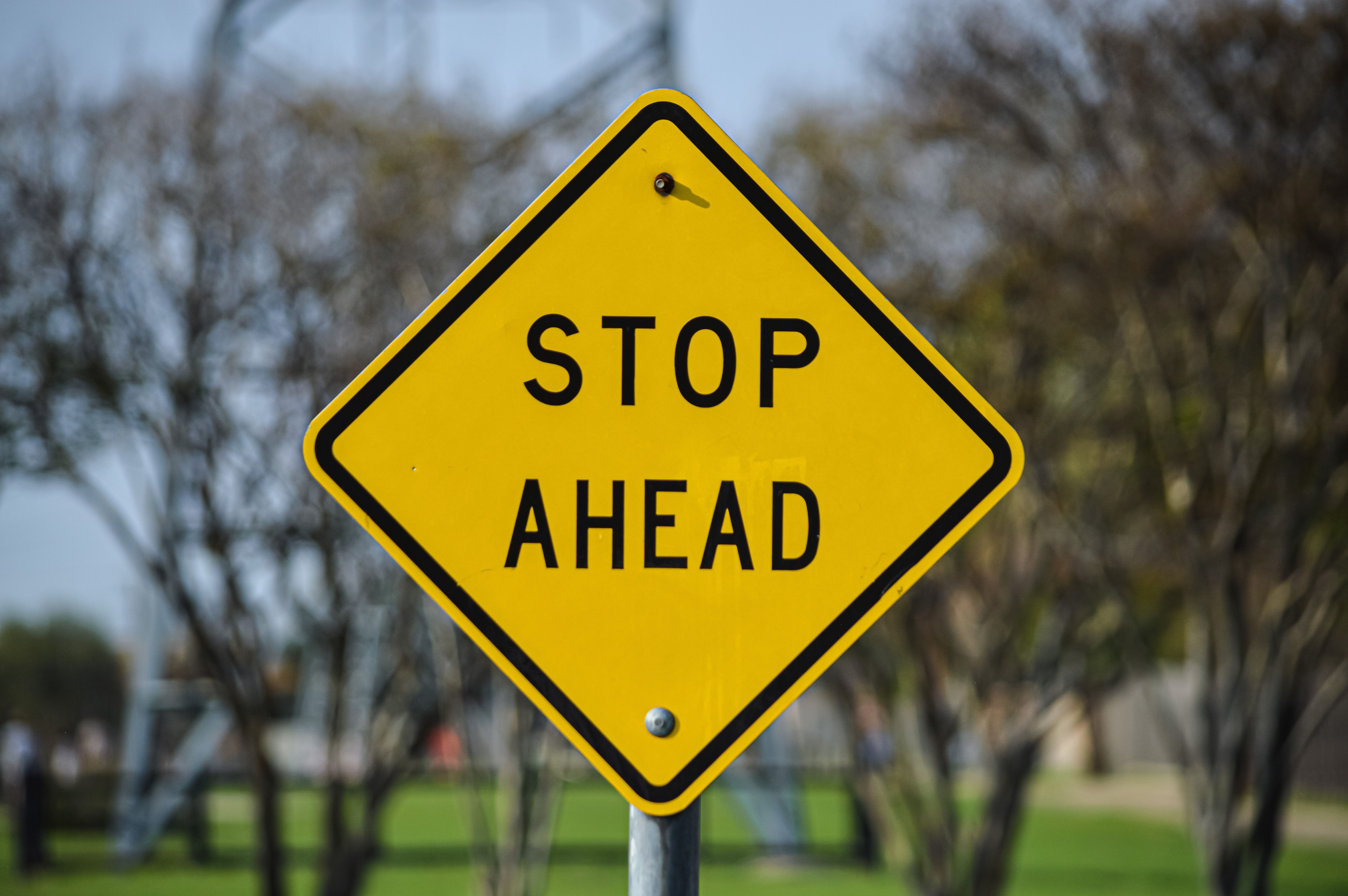 Stop Sign Ahead Warning in Dallas Park · Free Stock Photo