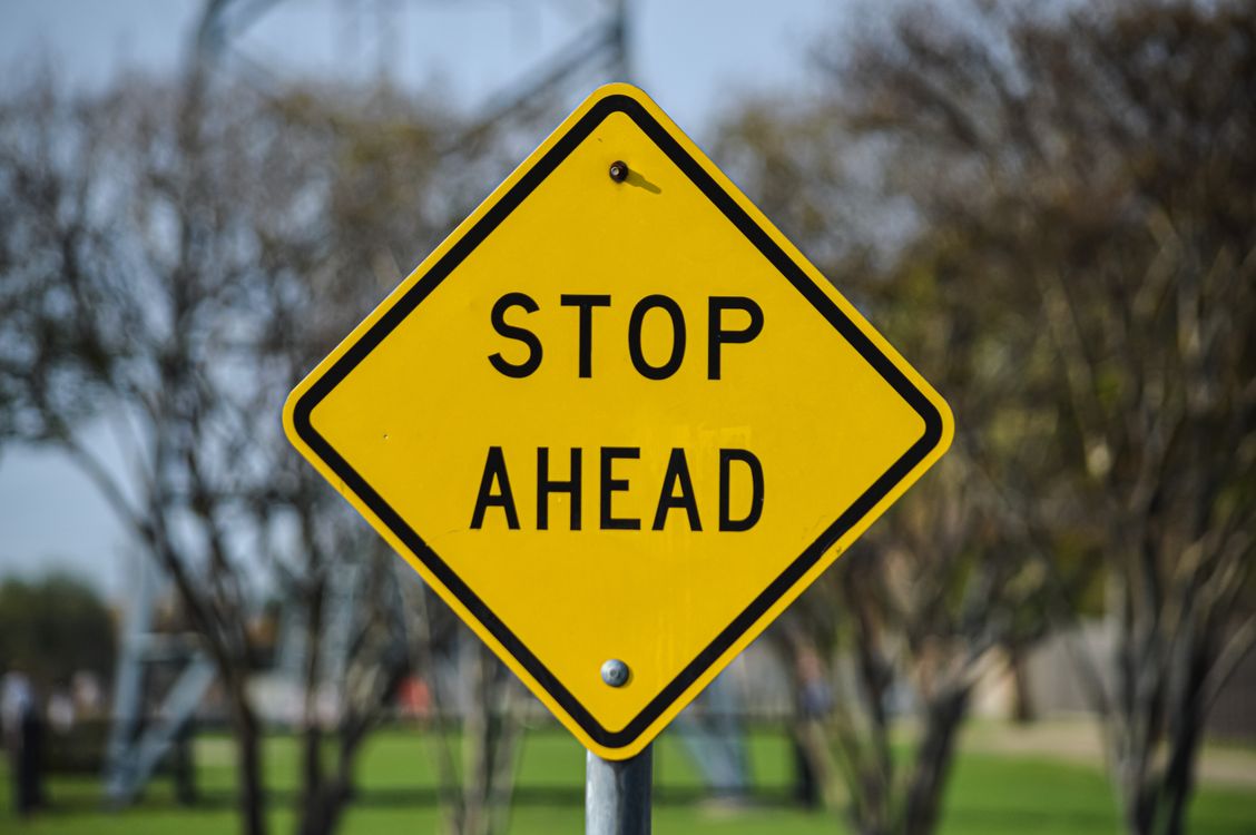 Stop Sign Ahead Warning in Dallas Park · Free Stock Photo