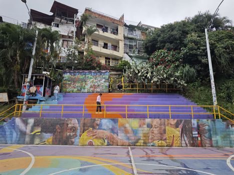 Comuna 13 graffiti with a local artist — Medellín