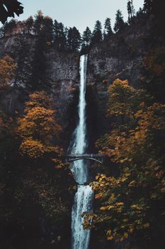 Stunning view of Multnomah Falls with vibrant autumn colors and cascading water.