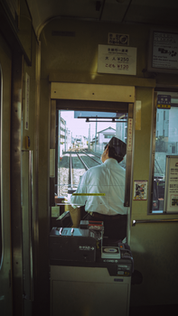 A glimpse from behind the train conductor's seat on a Japanese train in Kyoto.
