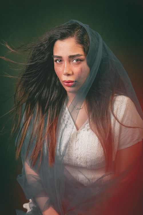 Free Artistic portrait of a woman with long hair and a veil in Hamedan, Iran. Stock Photo