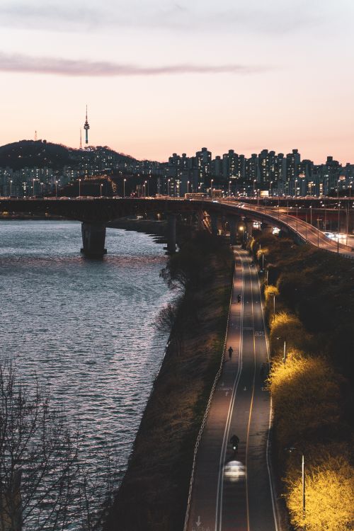 Free Stunning evening view of Seoul featuring Han River, Namsan Tower, and cityscape lights. Stock Photo
