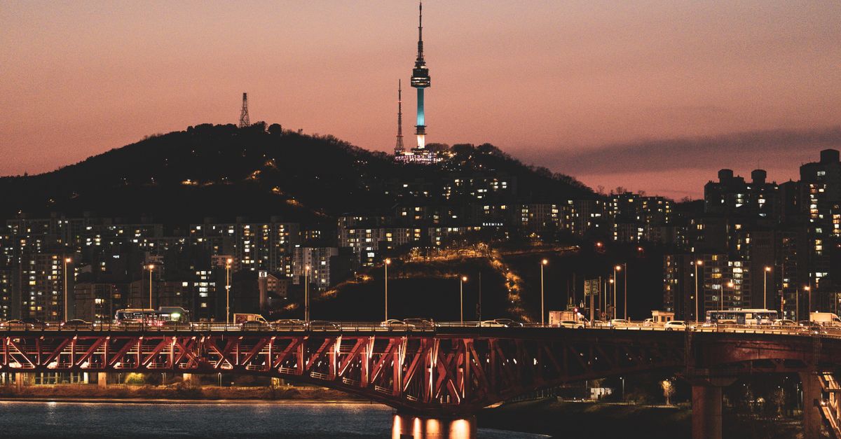Seoul skyline at twilight with Namsan Tower and city lights