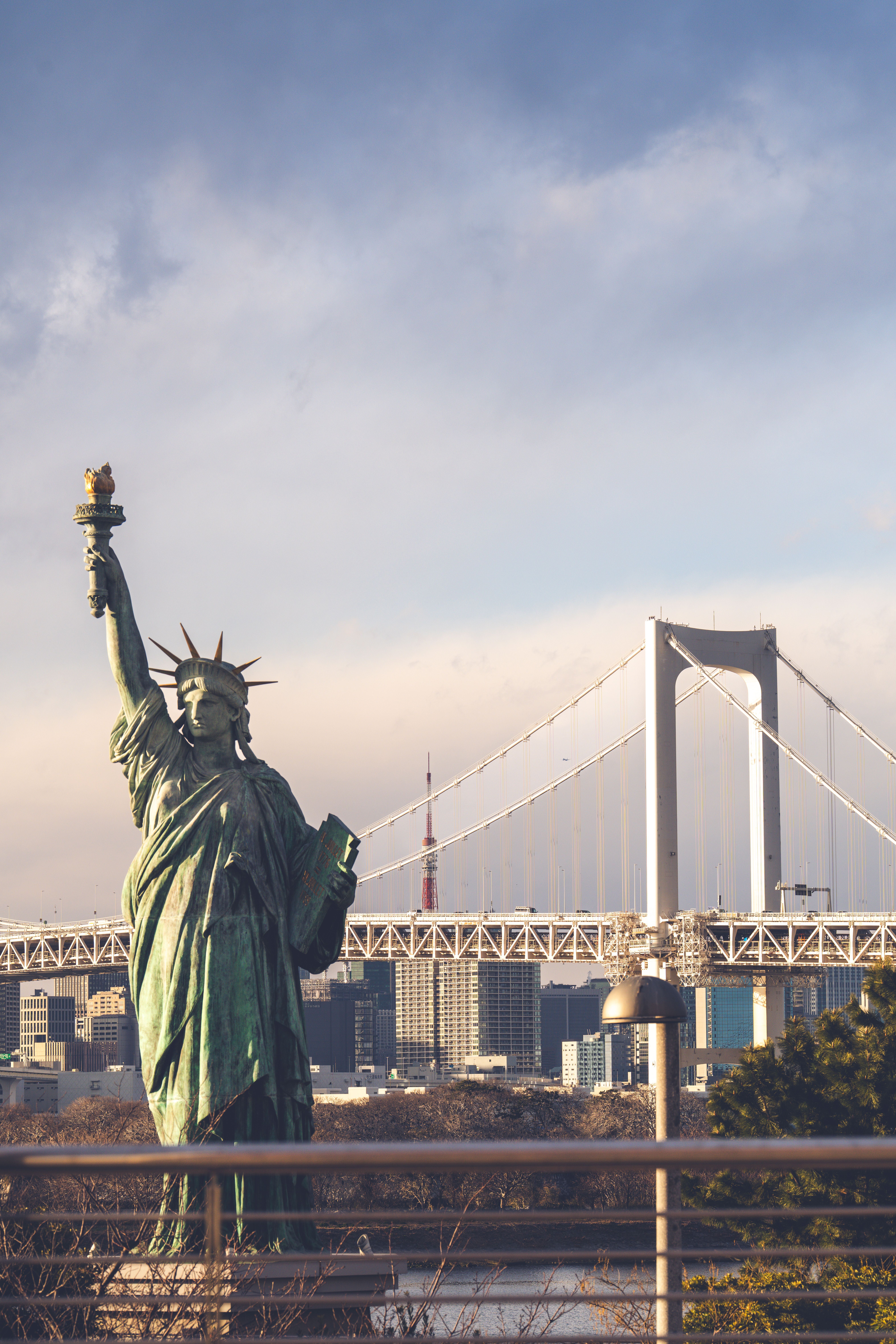 Statue of Liberty with Rainbow Bridge in Tokyo · Free Stock Photo
