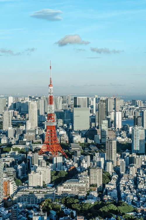 Free Stunning aerial view of Tokyo, showcasing the iconic Tokyo Tower amidst urban sprawl. Stock Photo