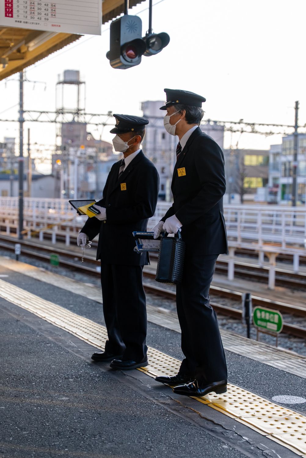 Train Assistant Train Station Workers in Uniform with Safety Masks · Free Stock Photo