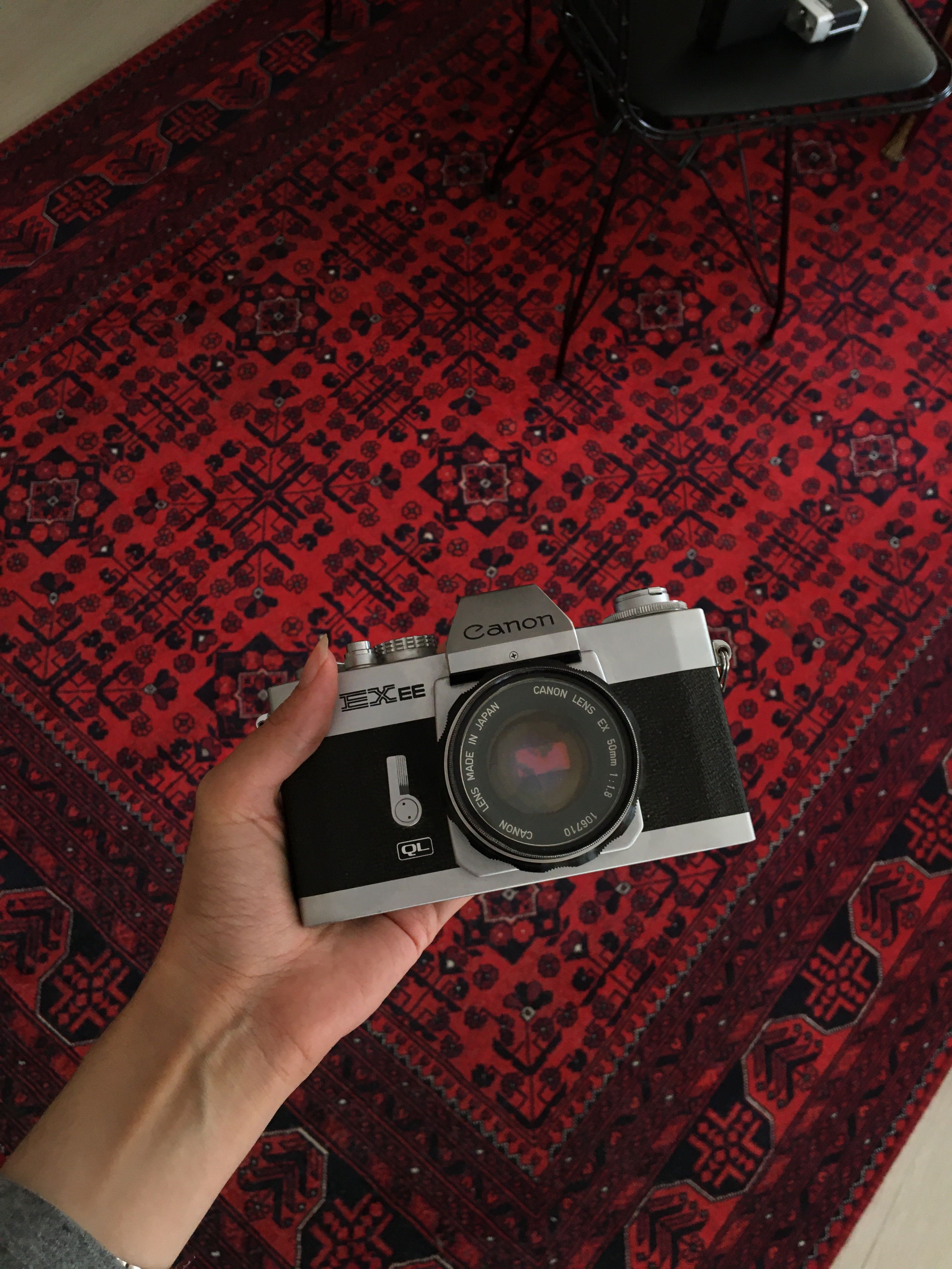 Vintage Film Camera on Oriental Rug Background · Free Stock Photo