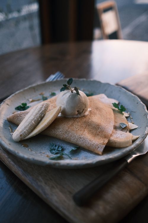 Free Savor this elegant banana crepe topped with ice cream, beautifully served at a cozy cafe in Nikko, Japan. Stock Photo