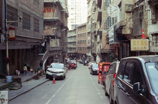 Busy street in Guiyang, showcasing urban life and architecture in Guizhou, China.