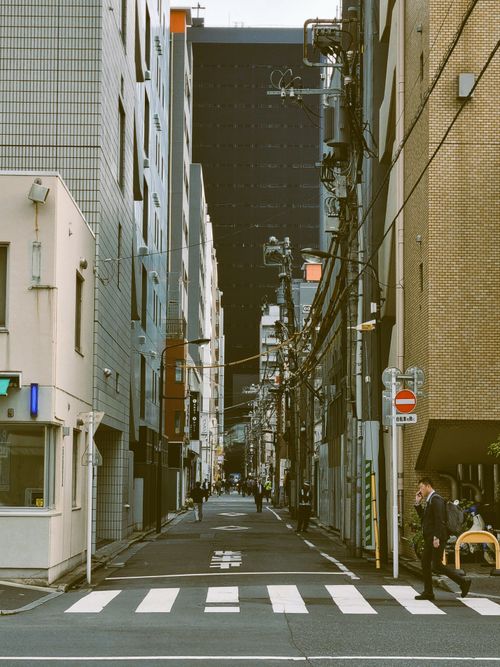 Free City street with skyscrapers and crosswalk, urban vibe. Stock Photo
