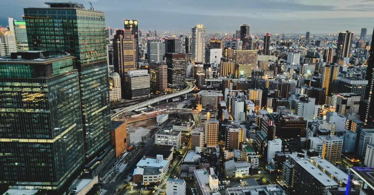 Breathtaking aerial shot capturing Osaka city's skyline and architecture at dusk.