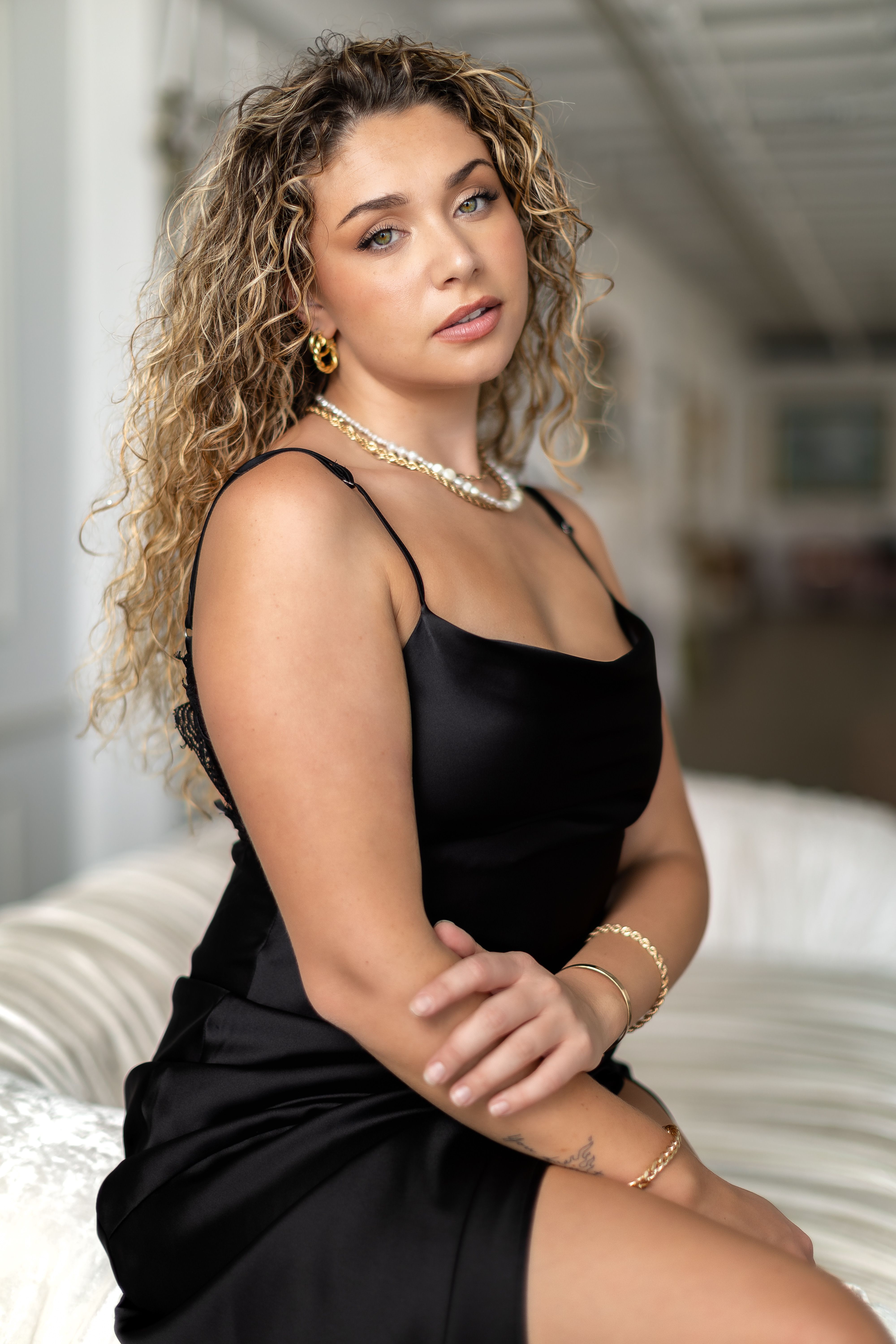 Elegant Woman Posing in Black Dress Indoors · Free Stock Photo