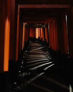 Explore the mesmerizing red torii gates of Fushimi Inari Shrine in Kyoto.