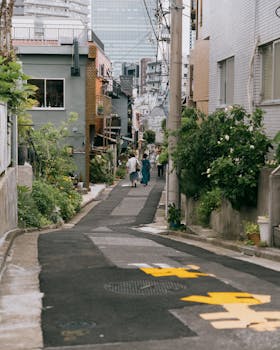 Explore the charming streets of Shinjuku City, Tokyo, showcasing traditional and modern architecture.