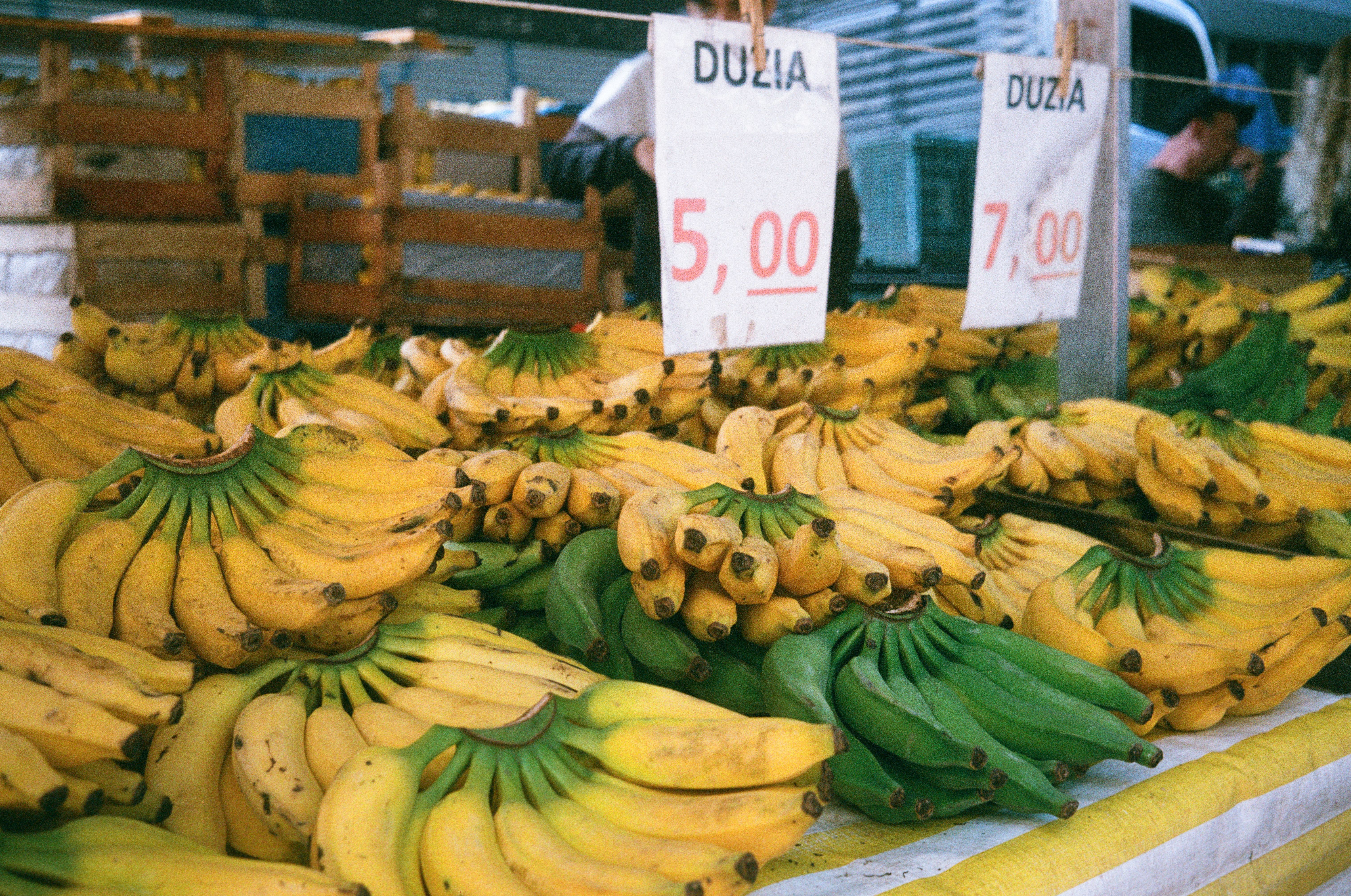 Vibrant stalls at Riga Central Market in Latvia, showcasing fresh local produce and baked goods.