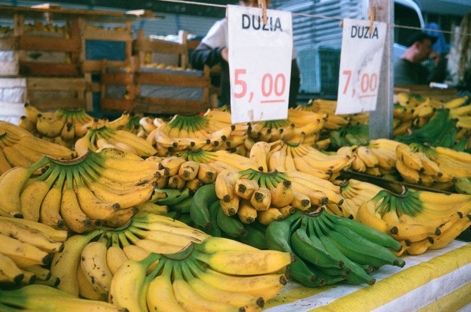 Vibrant stalls at Riga Central Market in Latvia, showcasing fresh local produce and baked goods.