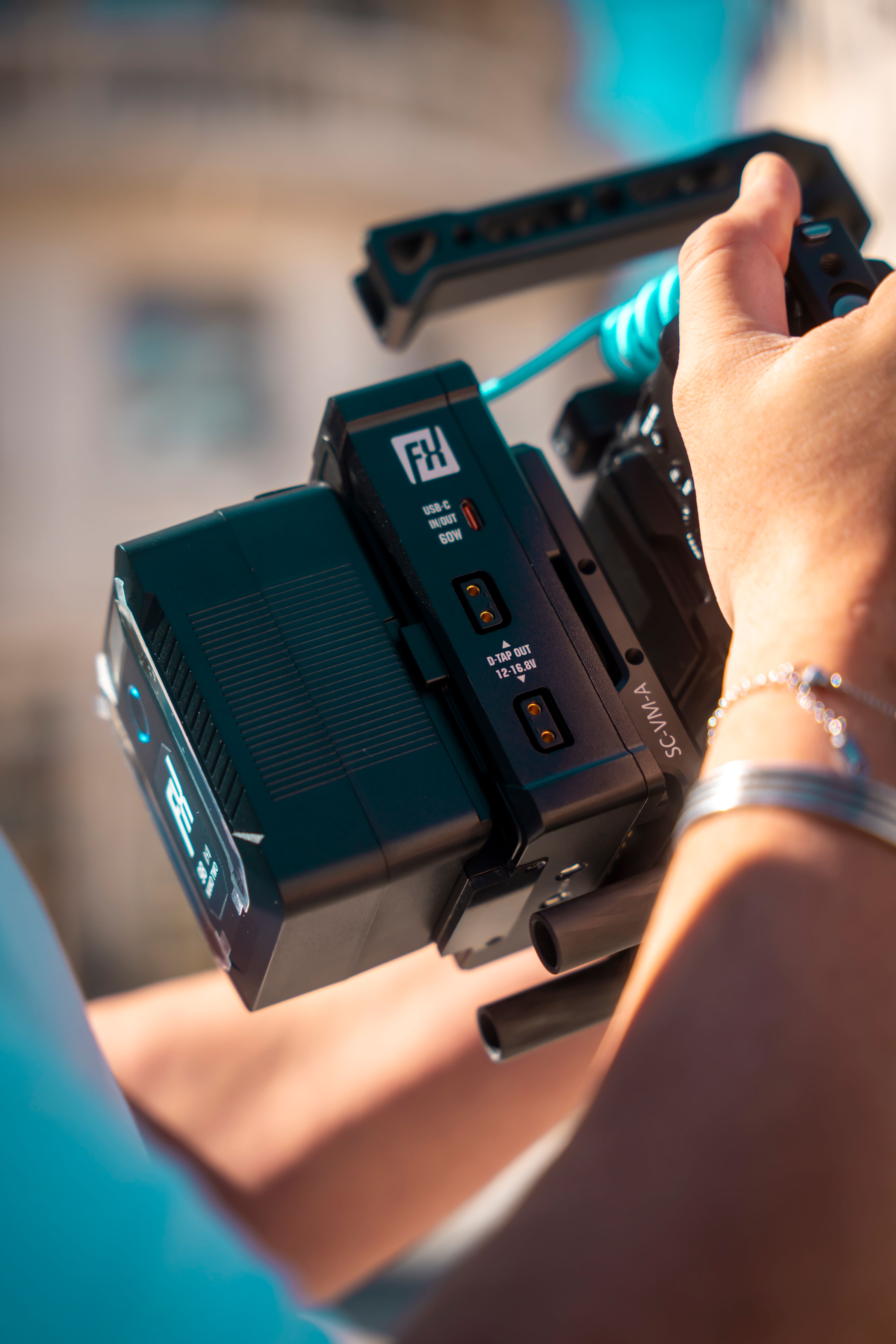 Close-Up of Person Operating Professional Video Camera · Free Stock Photo