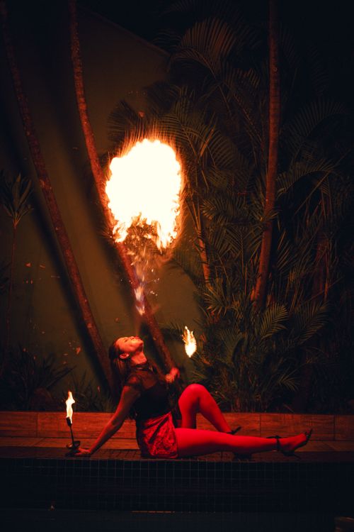 Free A captivating fire breather performing at night in a vibrant São Paulo setting. Stock Photo