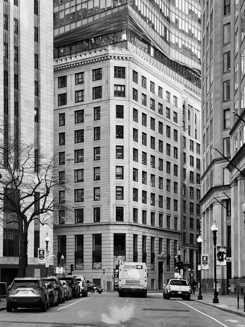 Free A striking black and white photo of urban architecture in a city street. Stock Photo
