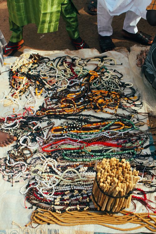 Free Vibrant assortment of prayer beads laid out at a market in Enugu, showcasing cultural diversity. Stock Photo