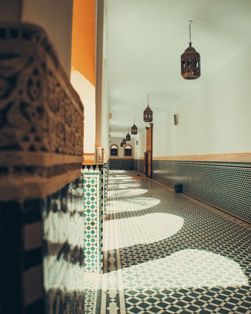 Free Explore the beauty of Moroccan tilework and designs in this stunning corridor shot. Stock Photo