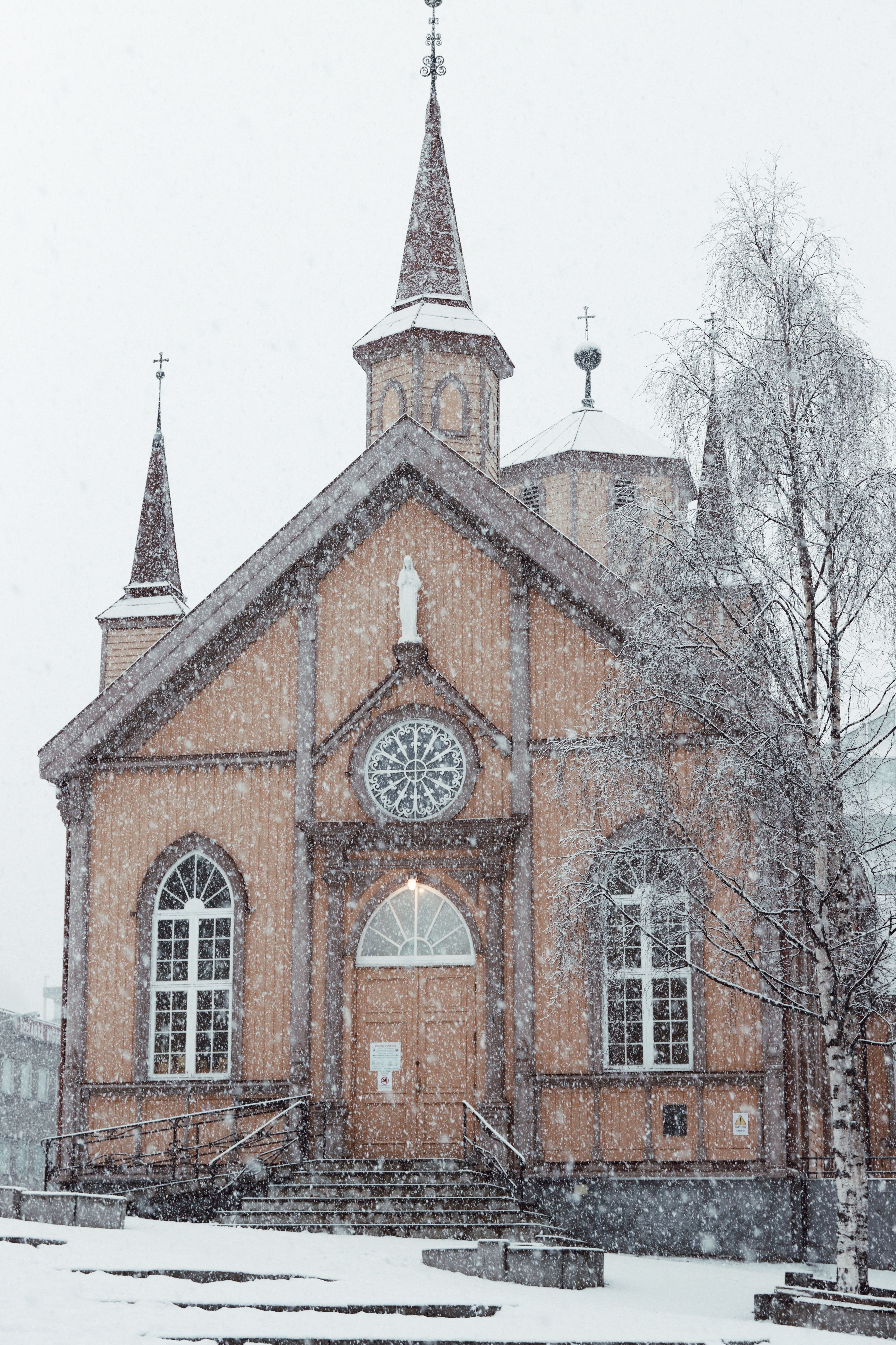 Tromsø Cathedral covered in snow during winter, showcasing Norwegian architecture.