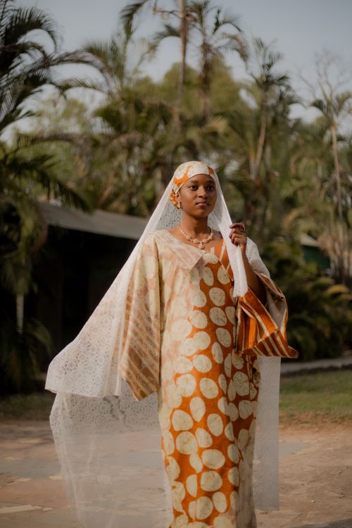 Free A woman in Abuja, Nigeria, wearing traditional bridal attire, surrounded by nature. Stock Photo