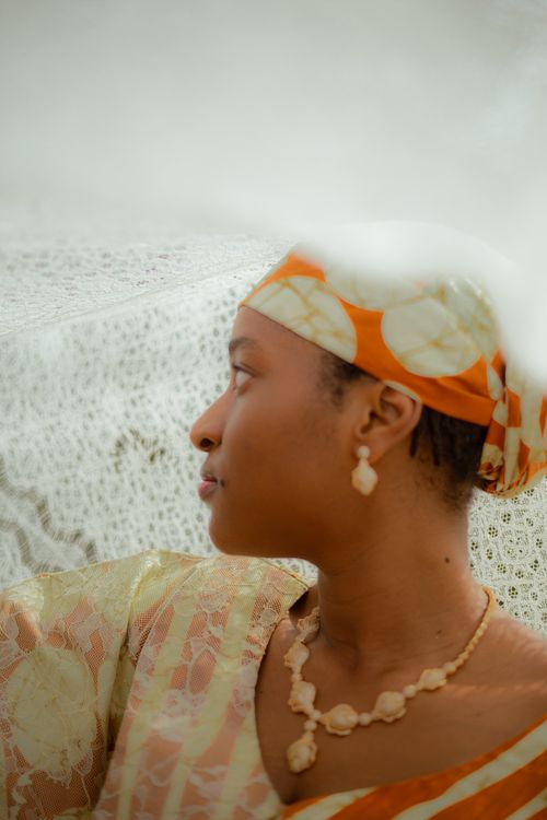 Free Portrait of an African woman in traditional attire with bridal accessories. Stock Photo