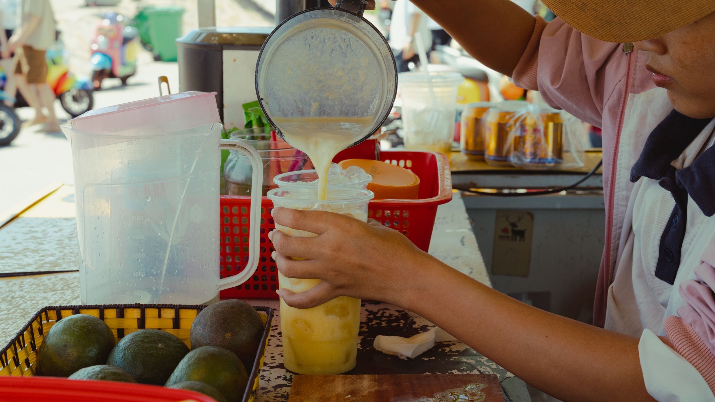 A street vendor prepares a fresh avocado smoothie in Bình Thuận, Vietnam.