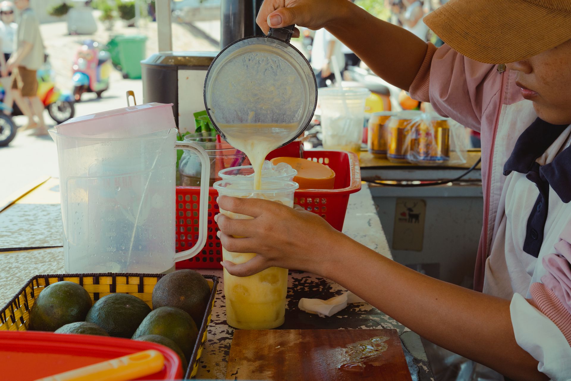 A street vendor prepares a fresh avocado smoothie in Bình Thuận, Vietnam.