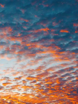 Dramatic sky with vibrant orange and purple clouds during sunset in Brazil, creating a stunning natural backdrop.