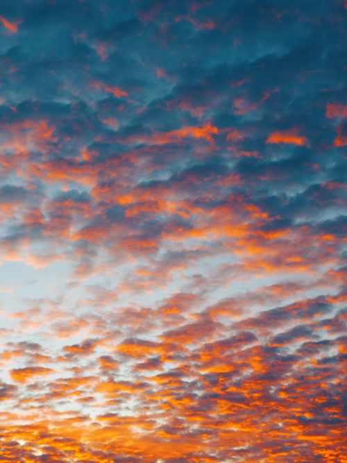 Free Dramatic sky with vibrant orange and purple clouds during sunset in Brazil, creating a stunning natural backdrop. Stock Photo