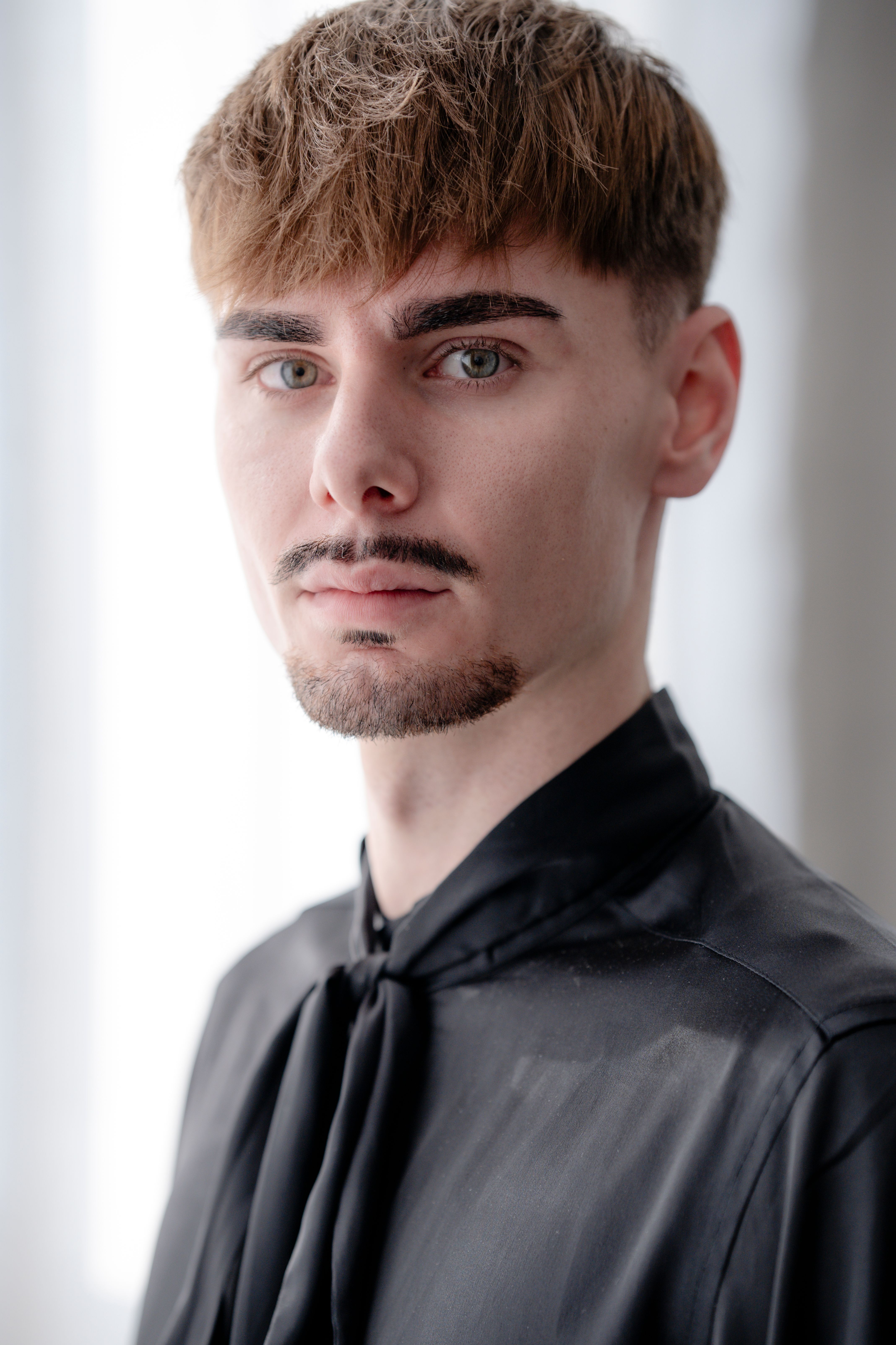 Portrait of a Young Man in a Black Shirt · Free Stock Photo