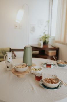 Inviting morning breakfast scene with oatmeal, tea, and elegant decor, perfect for a cozy start.