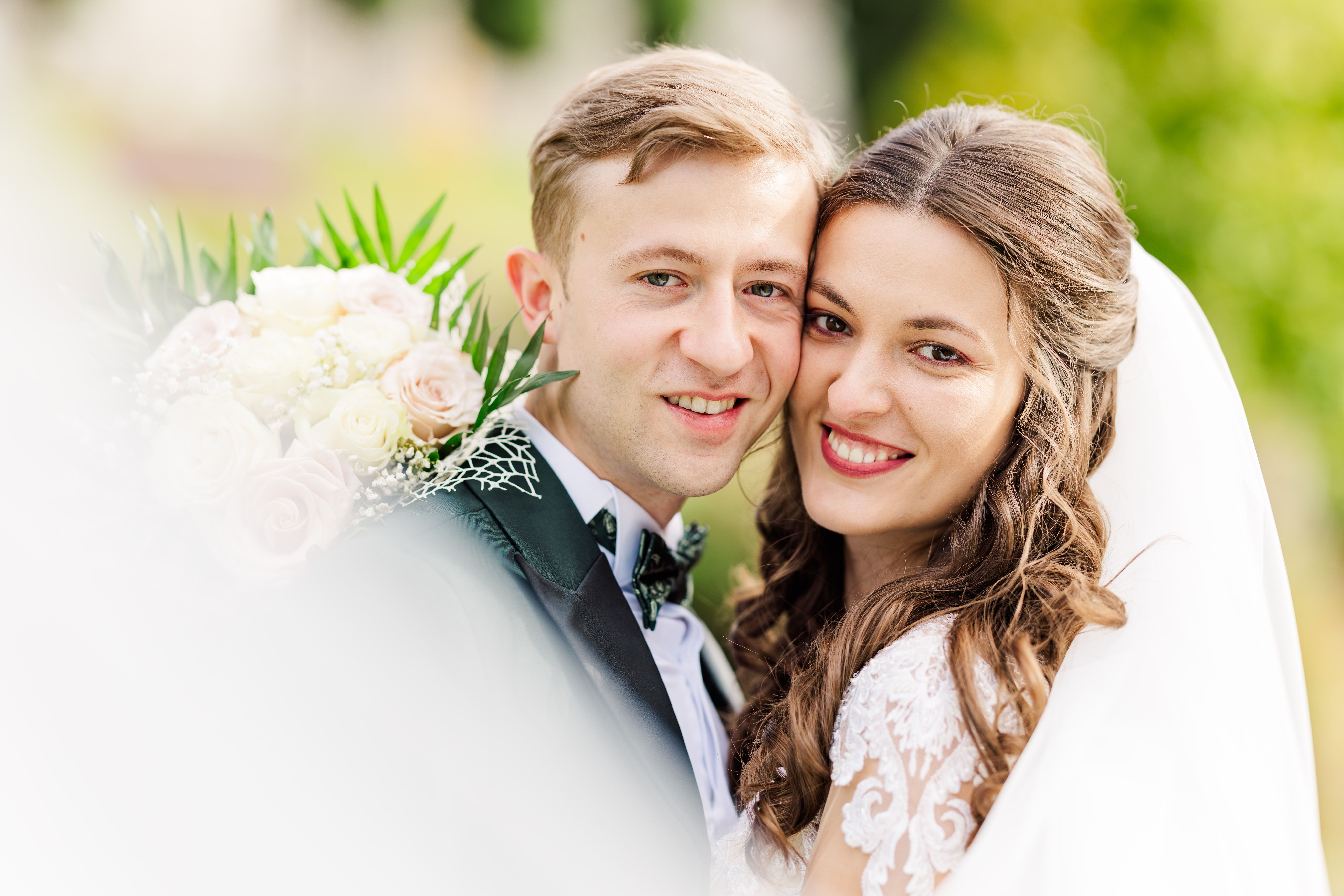 Charming outdoor wedding portrait of a smiling couple in Bușteni, România.