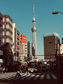A bustling street scene in Tokyo with the iconic Skytree tower and vibrant urban life.