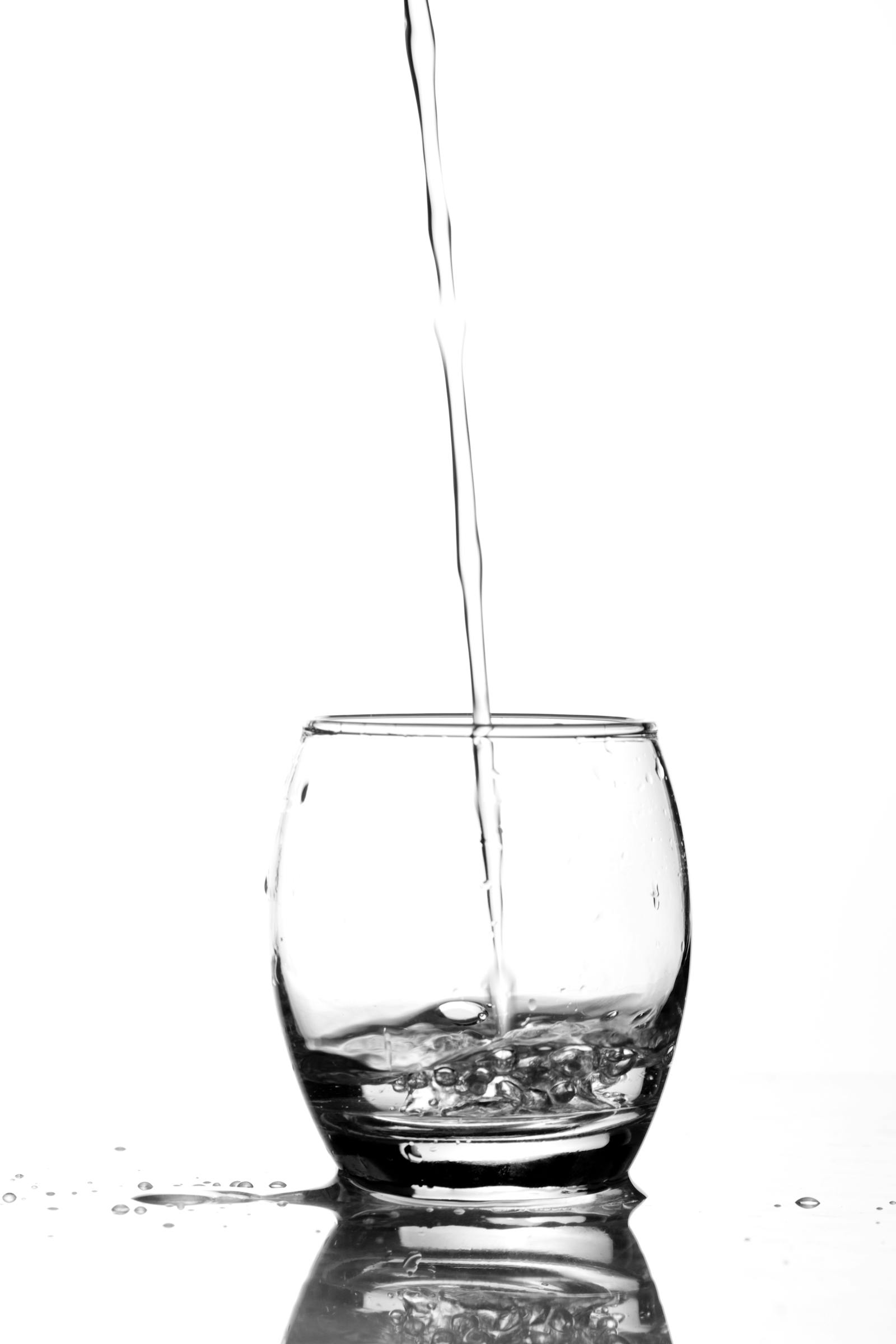 Glass of water being poured to emphasize hydration with fiber