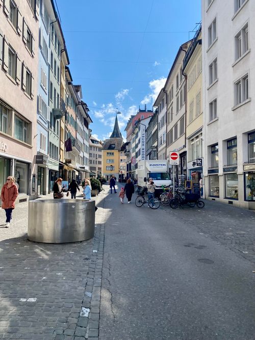 Free A vibrant street in Zurich captures the essence of Swiss urban life with shops and people. Stock Photo