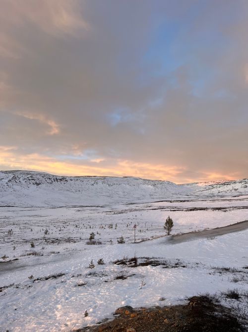 Free Beautiful sunset over snow-covered mountains in Dalarna, Sweden. Stock Photo