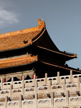 A striking view of the Forbidden City's architectural design, showcasing intricate eaves and historical majesty.