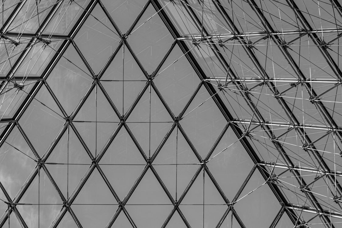 Pyramid Glass Building Geometric Patterns of the Louvre Pyramid Glass Structure · Free Stock Photo
