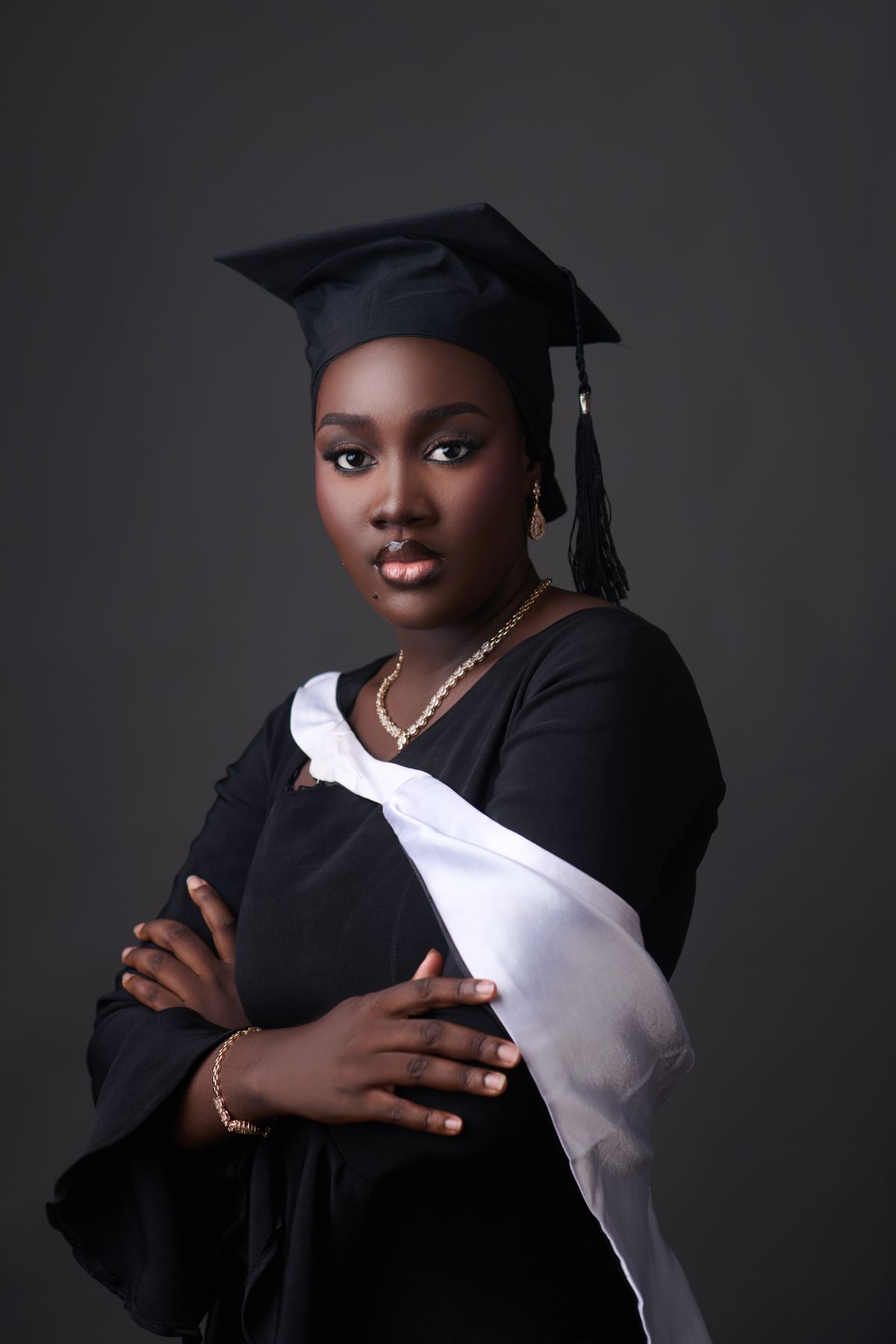 Proud graduate in cap and gown